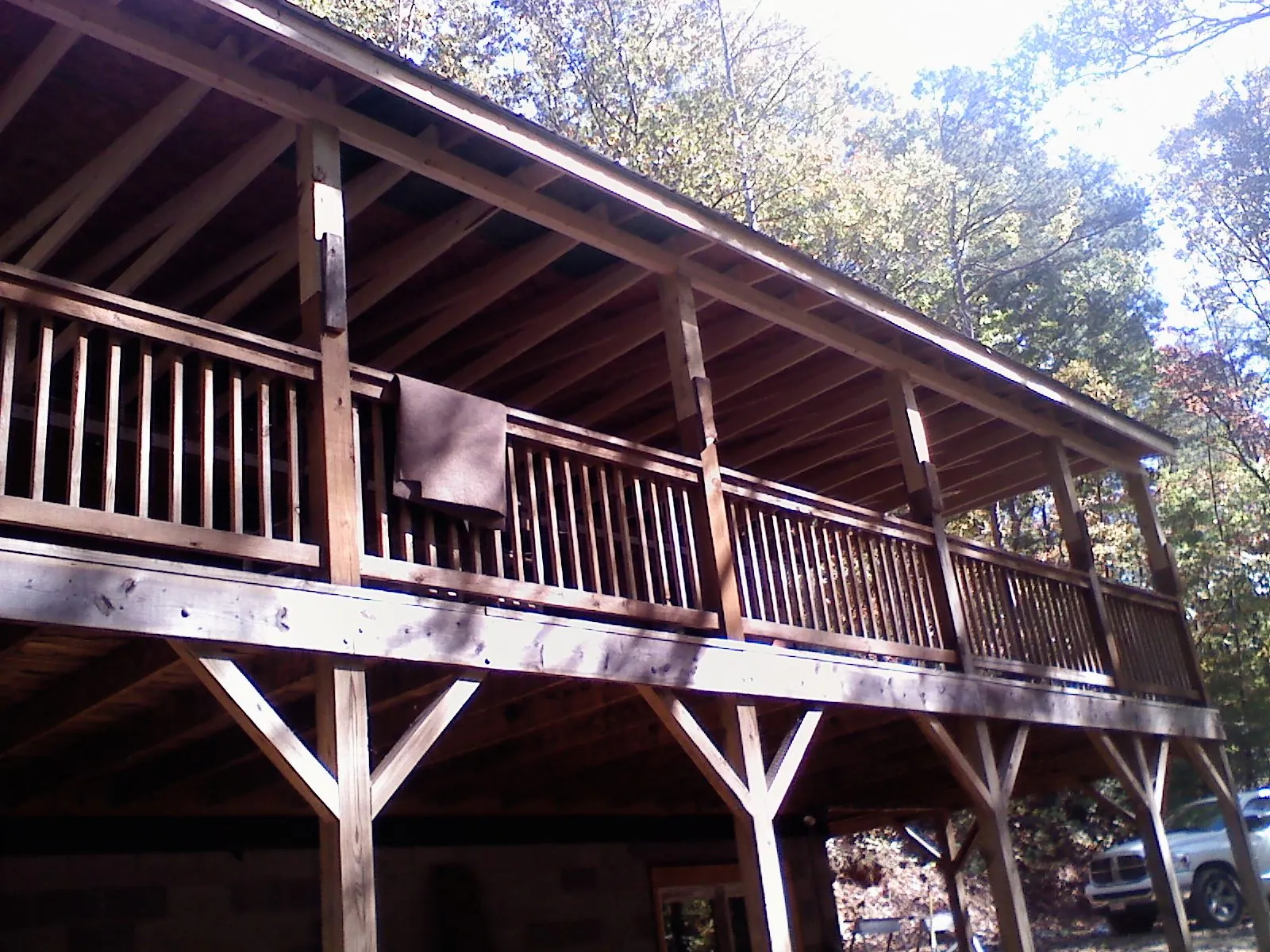 Timber framing under a new elevated porch and deck in Kalona